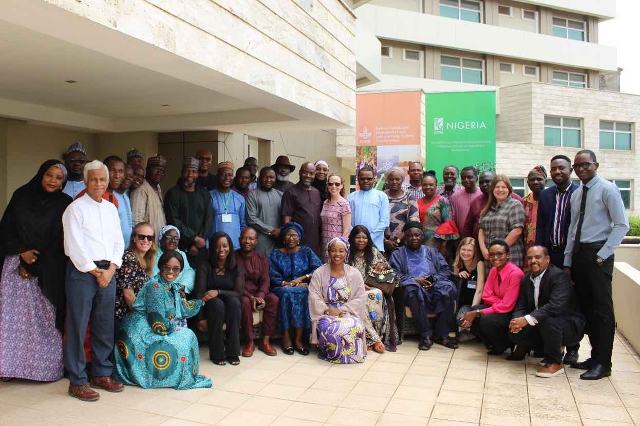 Group picture at entrance to building